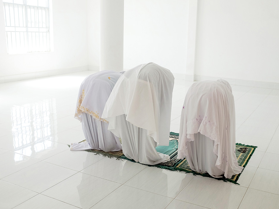 Vietnam - Midday prayers in the women's room at a mosque in the Muslim Cham village of Van Lam
